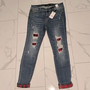 New with tags. Judy blue stretchy jean. With black and red checker accents.